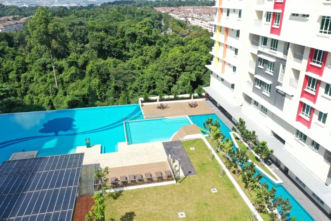 Alpinia Residence Aerial view of the Alpinia Residence building, swimming pool, and surrounding greenery. in Nilai, Freehold property development, photo