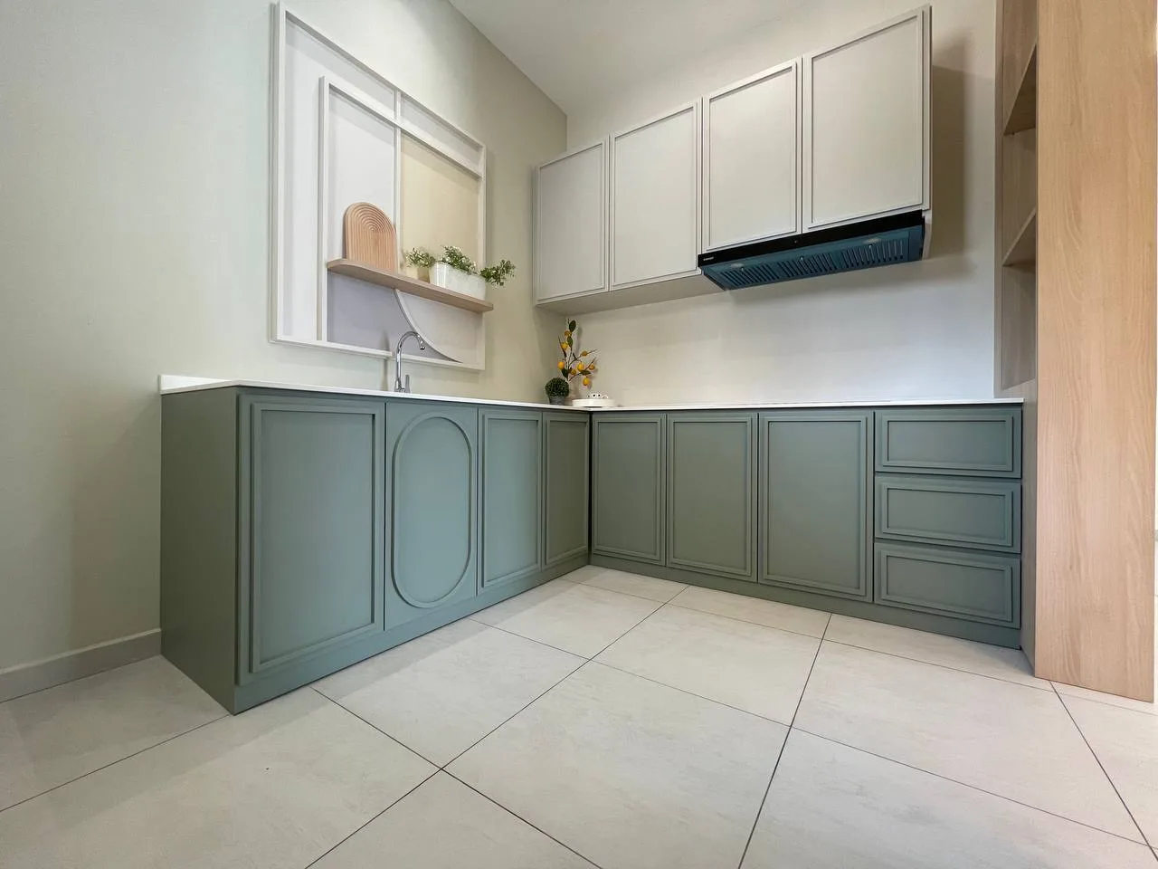 Alton Skyvillas Image shows a kitchen with green cabinets and white countertops. in Jelutong, Freehold property development, photo